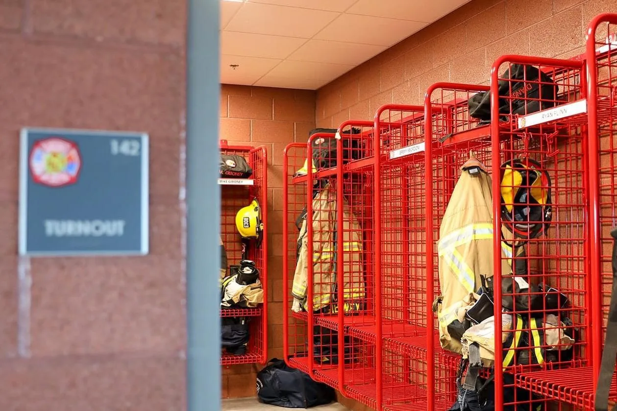 Turnout gear racked at a Surprise fire station.